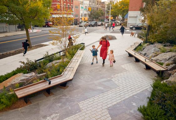 artist's impression of a new pedestrianised path showing a woman carrying an umbrella and two children